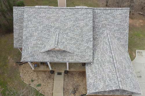 Light gray and white shingle home aerial view.