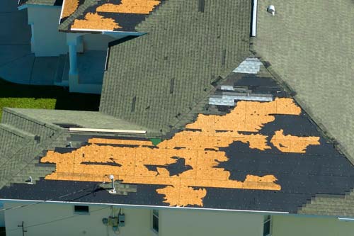 Storm damaged roofing: aerial view