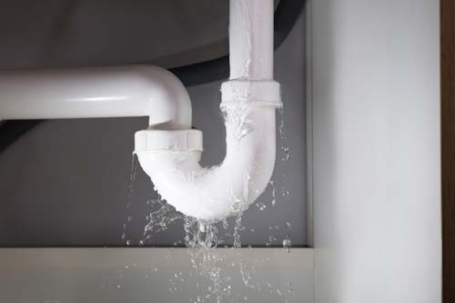 White U-pipe leaking water